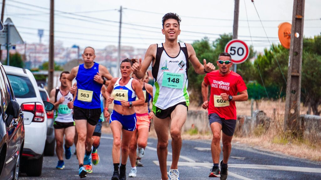 Vibrant scene of diverse runners enjoying a road race, showcasing fitness and competition.